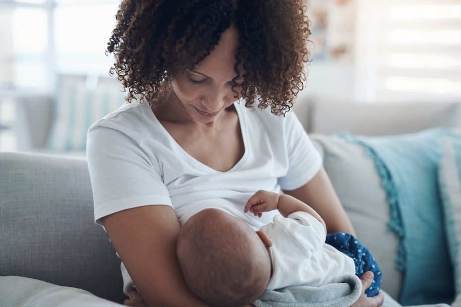 A mother stares down at her infant lovingly. A new study reveals that milk complement proteins can protect infants from gastro-intestinal infections on their own.